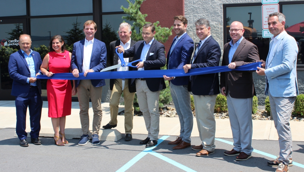 cardbox Packaging executives at ceremonial ribbon cutting in front of the plant in Pittston